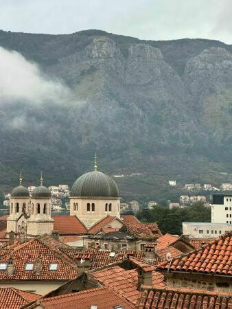 View of Kotor, Montenegro with the church and mountains behind.