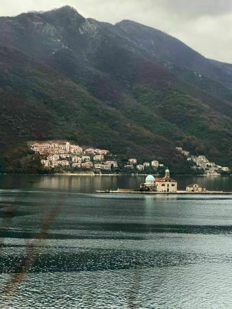 Blue Church on the Water -- Called Our Lady of the Rocks; this is located in the Bay of Kotor, Montenegro near Perast.