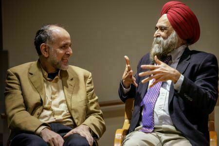 Dr. Waleed El-Ansary and Dr. Nirvikar Singh engage in conversation.