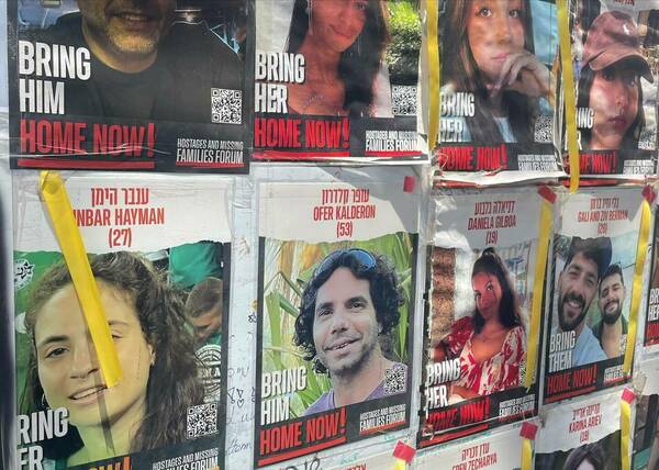 Posters seeking information on the hostages.