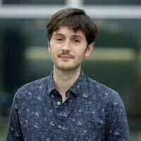 Picture of a Caucasian male with shortish brown hair. He is looking at the camera with a slight smile.